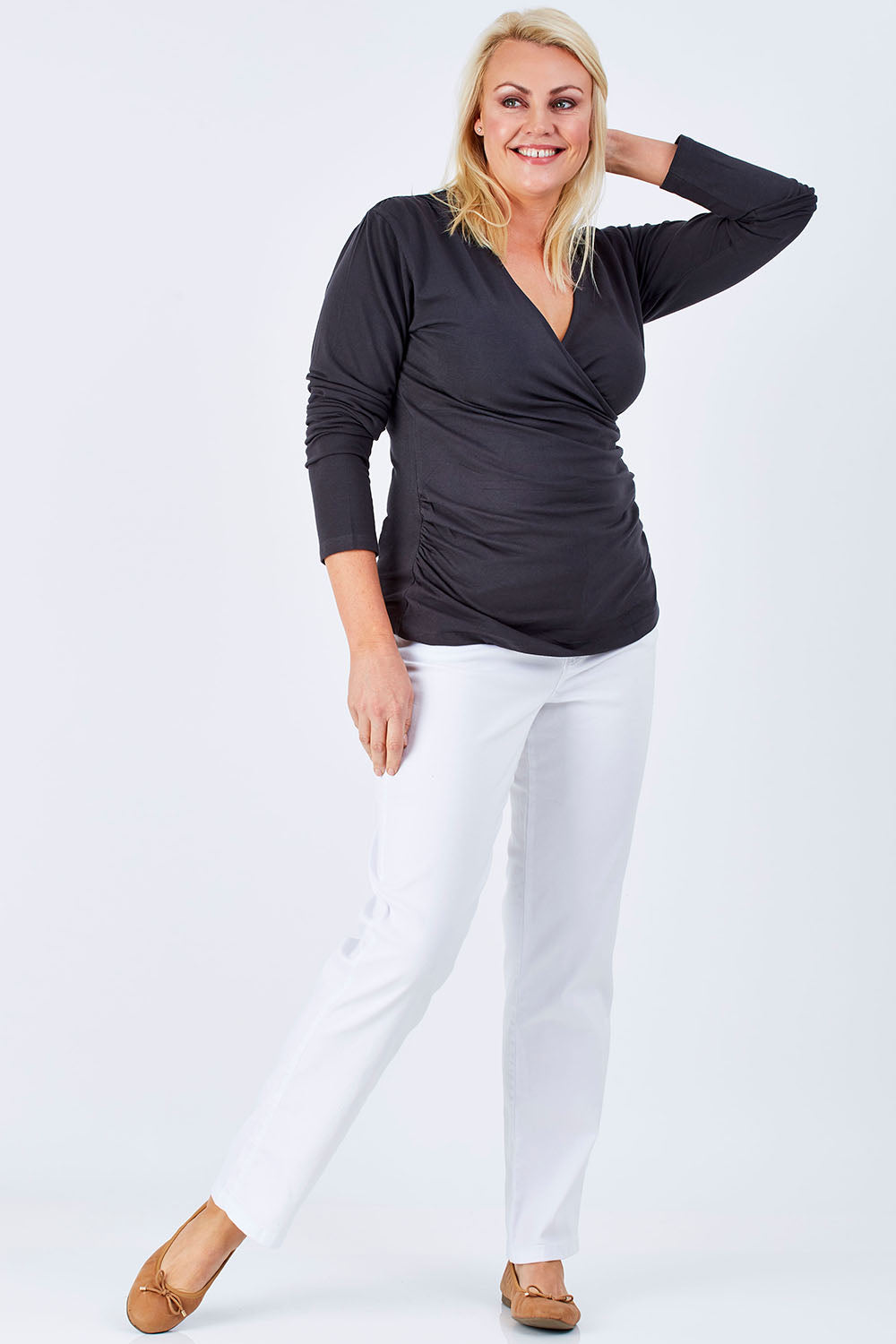 Model Natalie wearing size 16 of The Wrap Jersey Top in colour Charcoal (Grey), from the front, showing the whole outfit