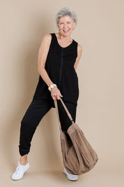 Model Elise wearing size 10 of The Cotton Bamboo Tank in colour Black (Black), from the front, showing the whole outfit