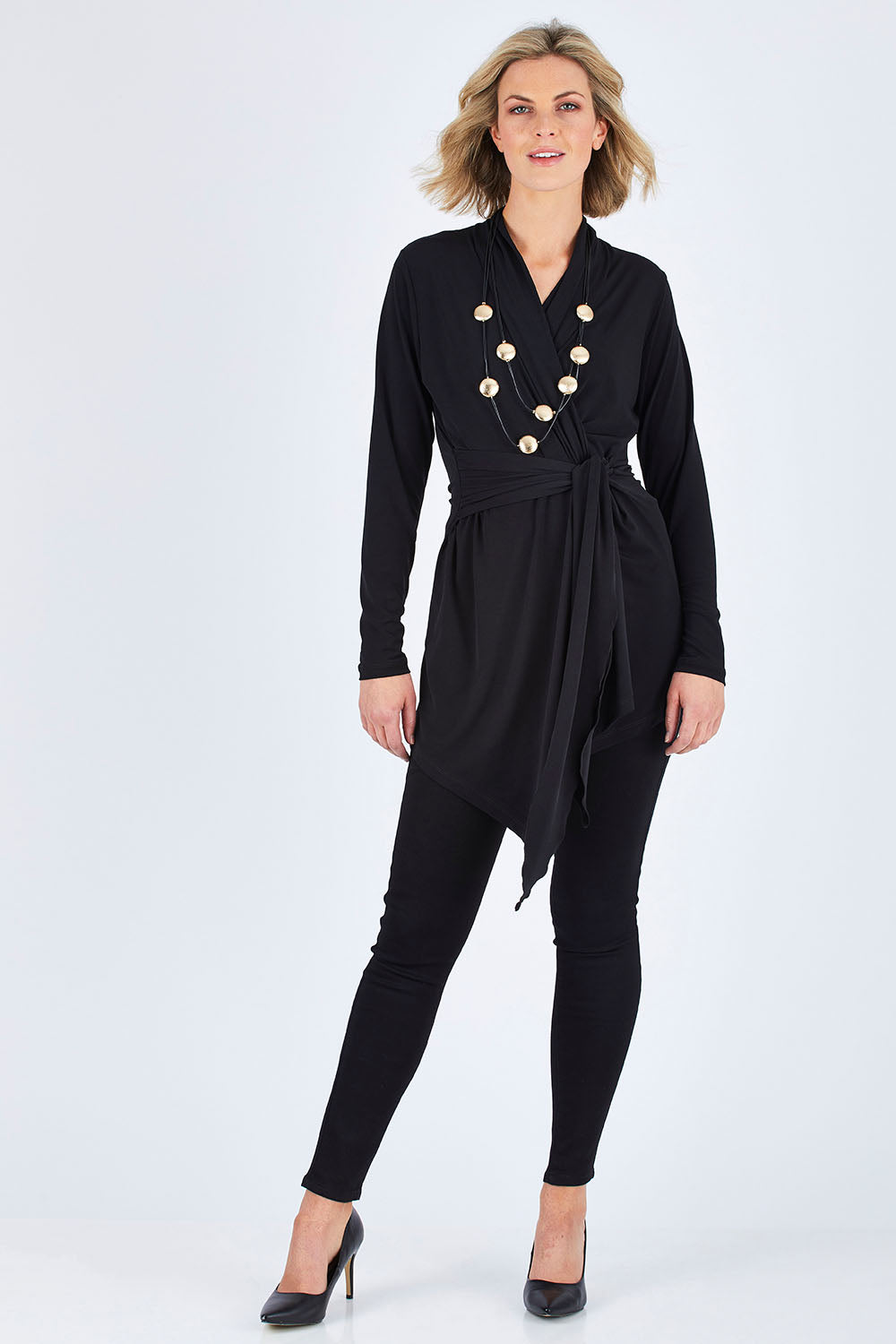 Model Chelsea wearing size 10 of The Ultimate Tie Cardi in colour Black (Black), from the front, showing the whole outfit