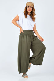 Model Laura wearing size 14 of The Wide Leg Relaxed Pant in colour Khaki (Green), from the front, showing the whole outfit