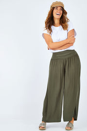Model Laura wearing size 14 of The Wide Leg Relaxed Pant in colour Khaki (Green), from the front, showing the whole outfit