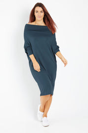 Model Laura wearing size 14 of The Multiin colourWay Dress - Forest (Green), from the front, showing the whole outfit