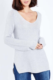 Model Andrea wearing size S of The Relaxed V Neck Pullover in colour Silver (Grey), from the front, cropped image