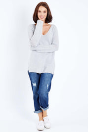 Model Andrea wearing size S of The Relaxed V Neck Pullover in colour Silver (Grey), from the front, showing the whole outfit