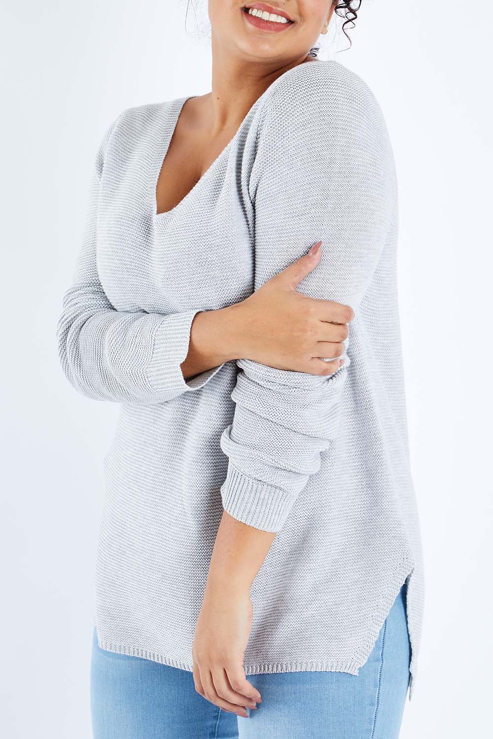 Model Sasha-Lee wearing size XL of The Relaxed V Neck Pullover in colour Silver (Grey), from the front, cropped image
