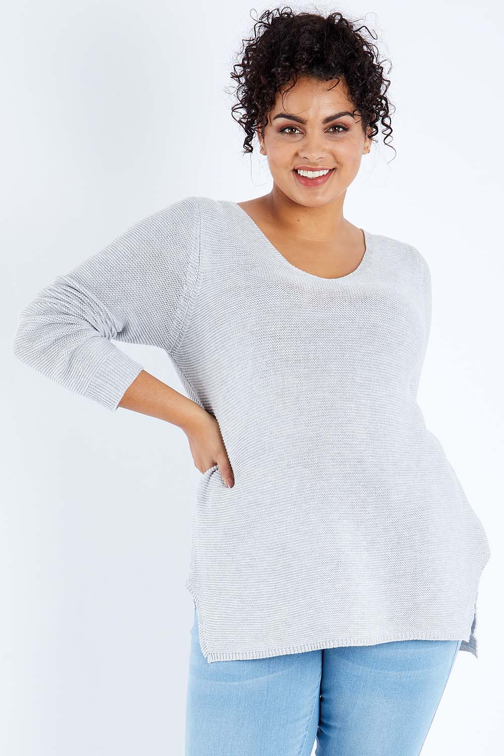 Model Sasha-Lee wearing size XL of The Relaxed V Neck Pullover in colour Silver (Grey), from the front, cropped image