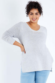 Model Sasha-Lee wearing size XL of The Relaxed V Neck Pullover in colour Silver (Grey), from the front, cropped image