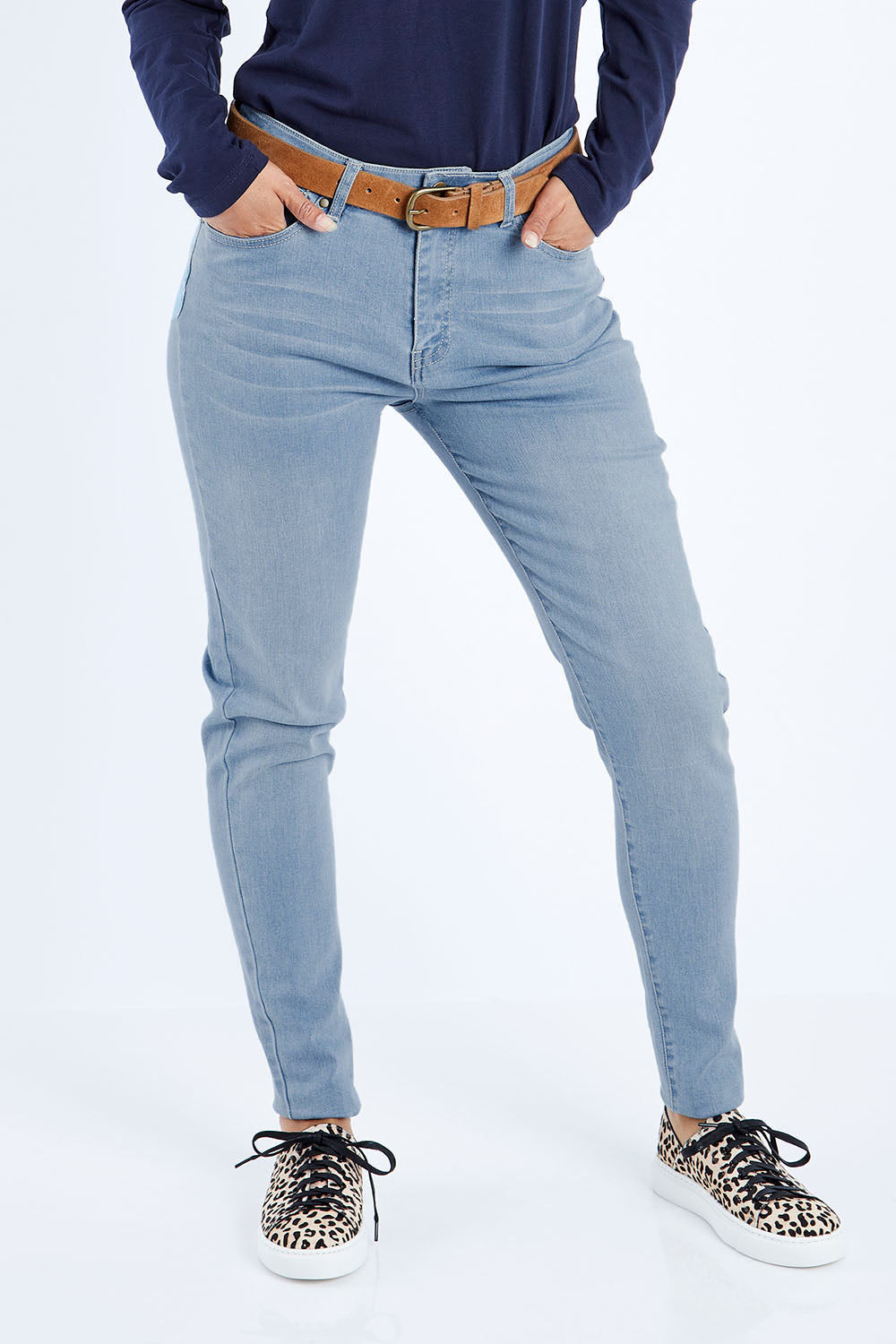 Model Kimberley wearing size 10 of The Mid Rise Skinny Jean in colour Lightdenim (Blue), from the front, cropped image