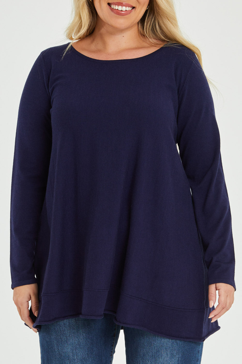 Model Katie wearing size XL of The Swing Knit in colour Navy (Blue), from the front, cropped image
