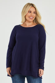 Model Katie wearing size XL of The Swing Knit in colour Navy (Blue), from the front, cropped image