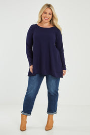 Model Katie wearing size XL of The Swing Knit in colour Navy (Blue), from the front, showing the whole outfit