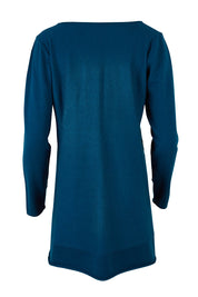 Product shot of The Swing Knit in colour Petrol (Blue), from the back