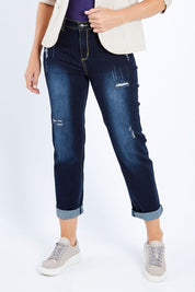 Model Bianca wearing size 10 of The Distressed Boyfriend Jean in colour Darkdenim (Blue), from the front, cropped image