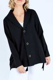 Model Chelsea wearing size S of The Button Up Ponte Jacket in colour Black (Black), from the front, cropped image