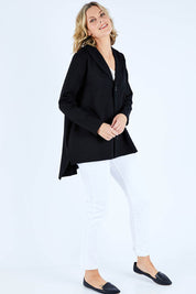 Model Chelsea wearing size S of The Button Up Ponte Jacket in colour Black (Black), from the front, showing the whole outfit