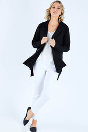 Model Chelsea wearing size S of The Button Up Ponte Jacket in colour Black (Black), from the front, showing the whole outfit