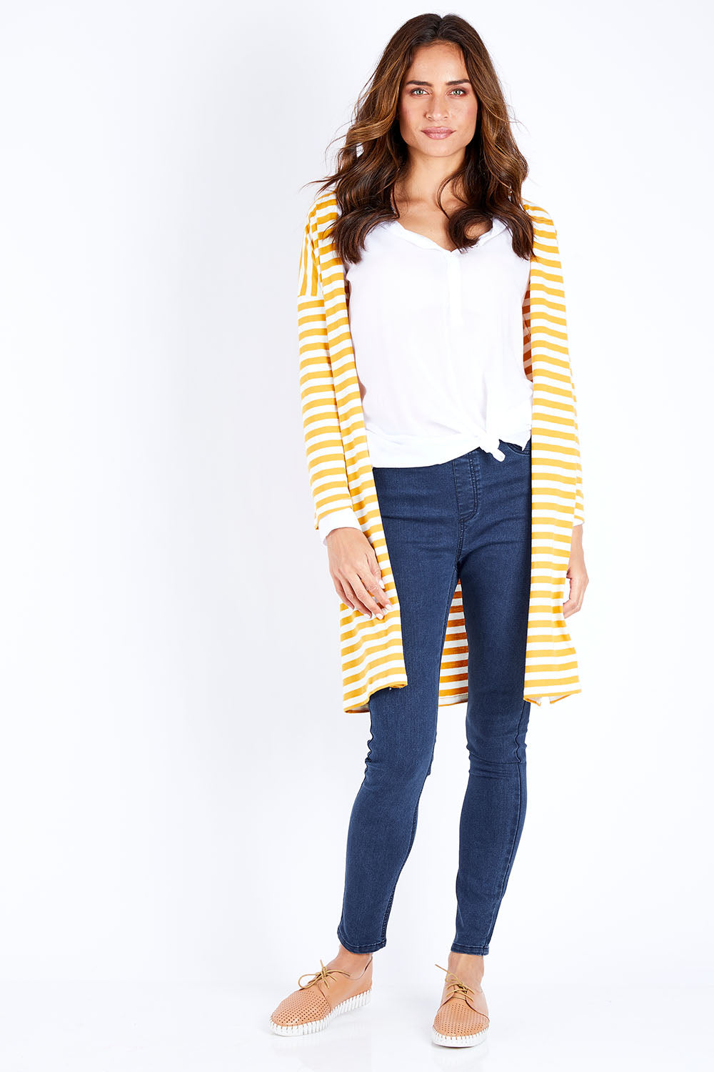 Model Ilona wearing size 10 of The Relaxed Cotton Cardi in colour Muststripe, from the front, showing the whole outfit