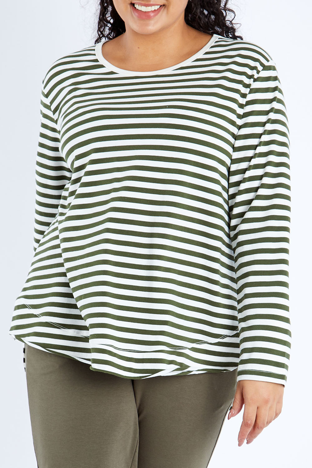 Model Sasha-Lee wearing size 16 of The Relaxed Cotton Long Sleeve Tee in colour Khaki (Green), from the front, cropped image
