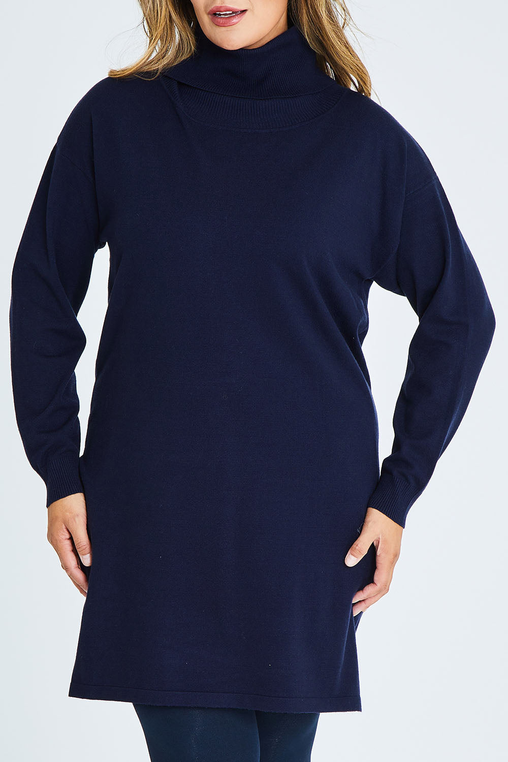 Model Palatina wearing size XL of The Roll Neck Tunic Dress in colour Navy (Blue), from the front, cropped image