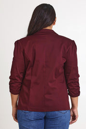 Model Ashleigh wearing size 16 of The Everyday Blazer in colour Burgundy (Purple), from the back