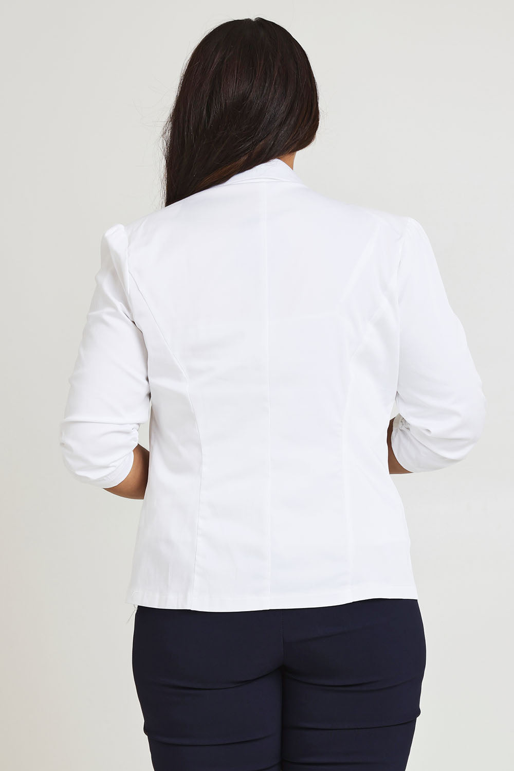 Model Ashleigh wearing size 16 of The Everyday Blazer in colour White (White), from the back