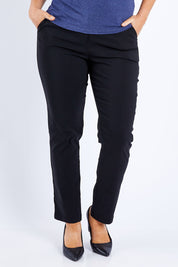 Model Laura wearing size 12 of The Slim Cut Stretch Pant in colour Black (Black), from the front, cropped image