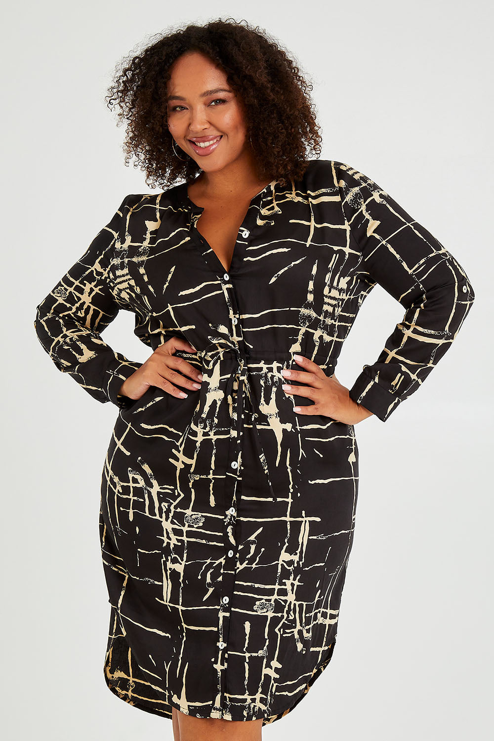 Model Alexis wearing size 16 of The Luxe Viscose Drawstring Dress in colour Sketch (Black), from the front, cropped image