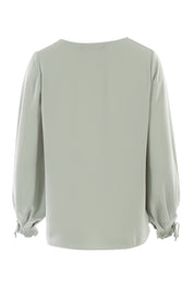 Product shot of The Pleated Sleeve Top in colour Sage (Green), from the back