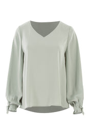 Product shot of The Pleated Sleeve Top in colour Sage (Green), from the front