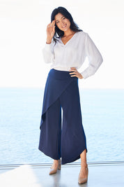 Model Miranda wearing size 10 of The Cross Over Pant in colour Navy (Blue), from the front, showing the whole outfit