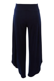 Product shot of The Cross Over Pant in colour Navy (Blue), from the back