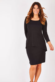 Model Laura wearing size 12 of The Long Rita Dress in colour Black (Black), from the front, showing the whole outfit