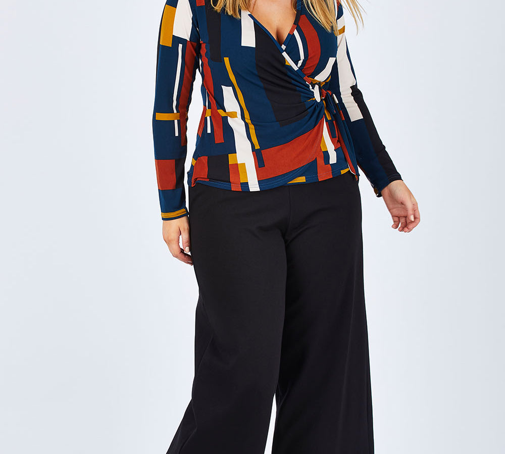 Model Jess wearing size 14 of The Wide Leg Ponte Pant in colour Black (Black), from the front, showing the whole outfit