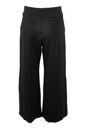 Product shot of The Wide Leg Ponte Pant in colour Jetblack (Black), from the back
