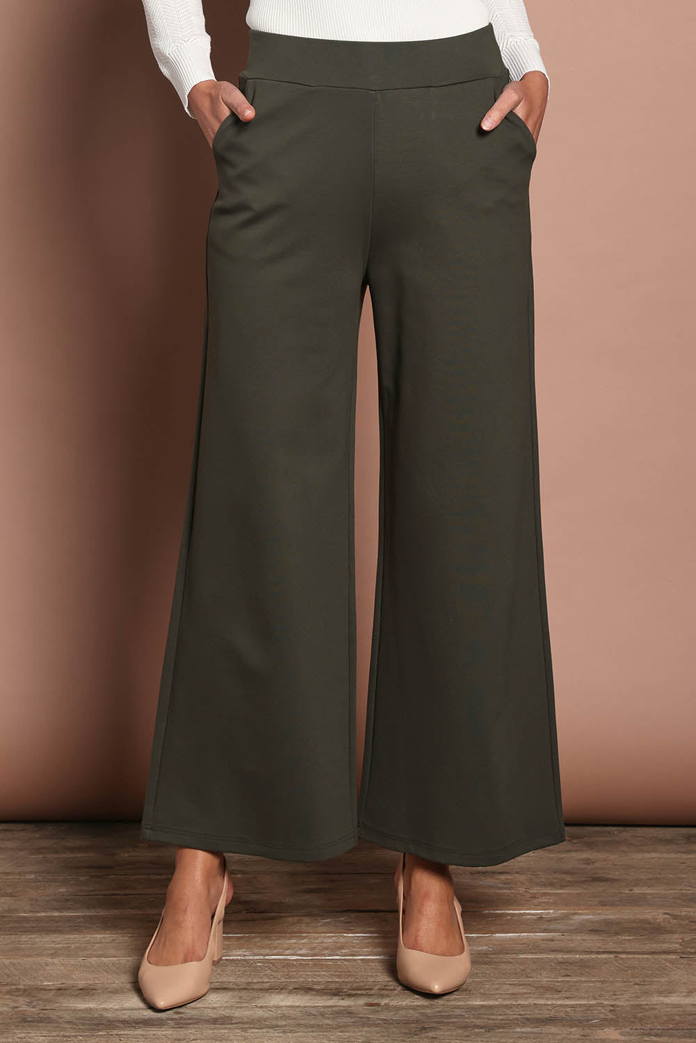 Model Amanda wearing size 10 of The Wide Leg Ponte Pant in colour Khakigreen (Green), from the front, cropped image