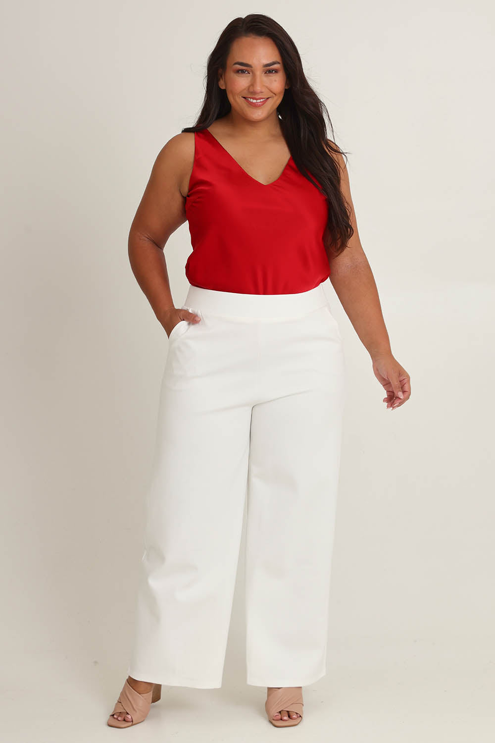 Model Ashleigh wearing size 16 of The Wide Leg Ponte Pant in colour Pearl (White), from the front, showing the whole outfit
