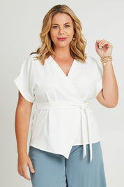 Model Fiona wearing size 16 of The Kimono Top in colour Ivory (White), from the front, cropped image