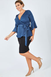 Model Fiona wearing size 16 of The Luxe Wrap Top in colour Opal (Blue), from the front, showing the whole outfit