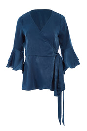 Product shot of The Luxe Wrap Top in colour Opal (Blue), from the front