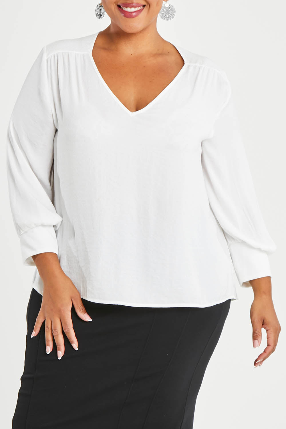 Model Alexis wearing size 16 of The Luxe Dobby Blouse in colour White (White), from the front, cropped image
