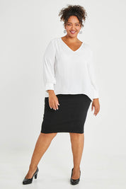 Model Alexis wearing size 16 of The Luxe Dobby Blouse in colour White (White), from the front, showing the whole outfit