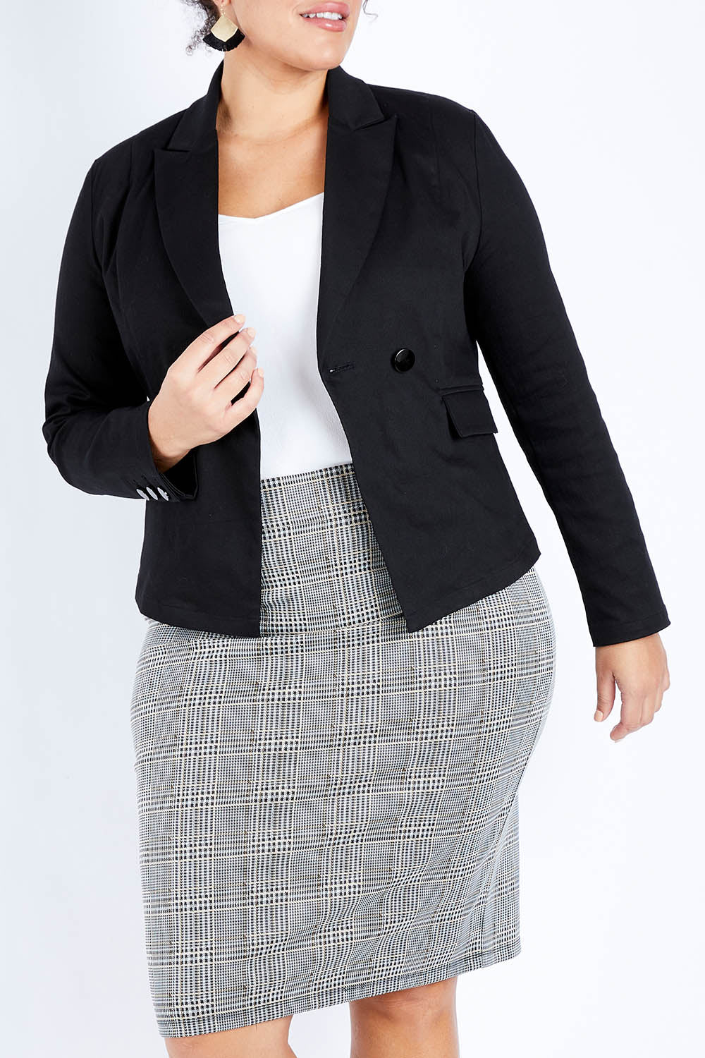 Model Jess wearing size 16 of The Desire Jacket in colour Black (Black), from the front, cropped image