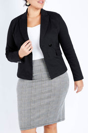 Model Jess wearing size 16 of The Desire Jacket in colour Black (Black), from the front, cropped image