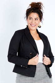 Model Jess wearing size 16 of The Desire Jacket in colour Black (Black), from the front, cropped image