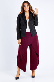 Model Laura wearing size 14 of The Desire Jacket in colour Black (Black), from the front, showing the whole outfit