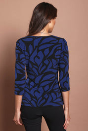 Model Madeline wearing size 10 of The Printed Side Ring Detail Blouse in colour Bluevines (Blue), from the back