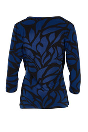 Product shot of The Printed Side Ring Detail Blouse in colour Bluevines (Blue), from the back