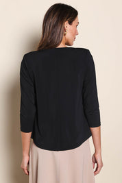 Model Madelinec wearing size 10 of the The Modern Shrug – Black in colour Black, from the back