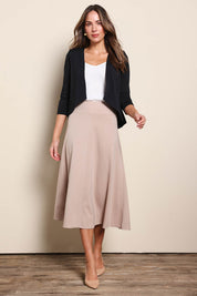 Model Madelinec wearing size 10 of the The Modern Shrug – Black in colour Black, from the front