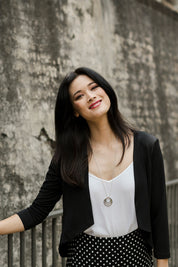 Model Miranda wearing size 10 of The Modern Shrug in colour Black (Black), from the front, showing the whole outfit